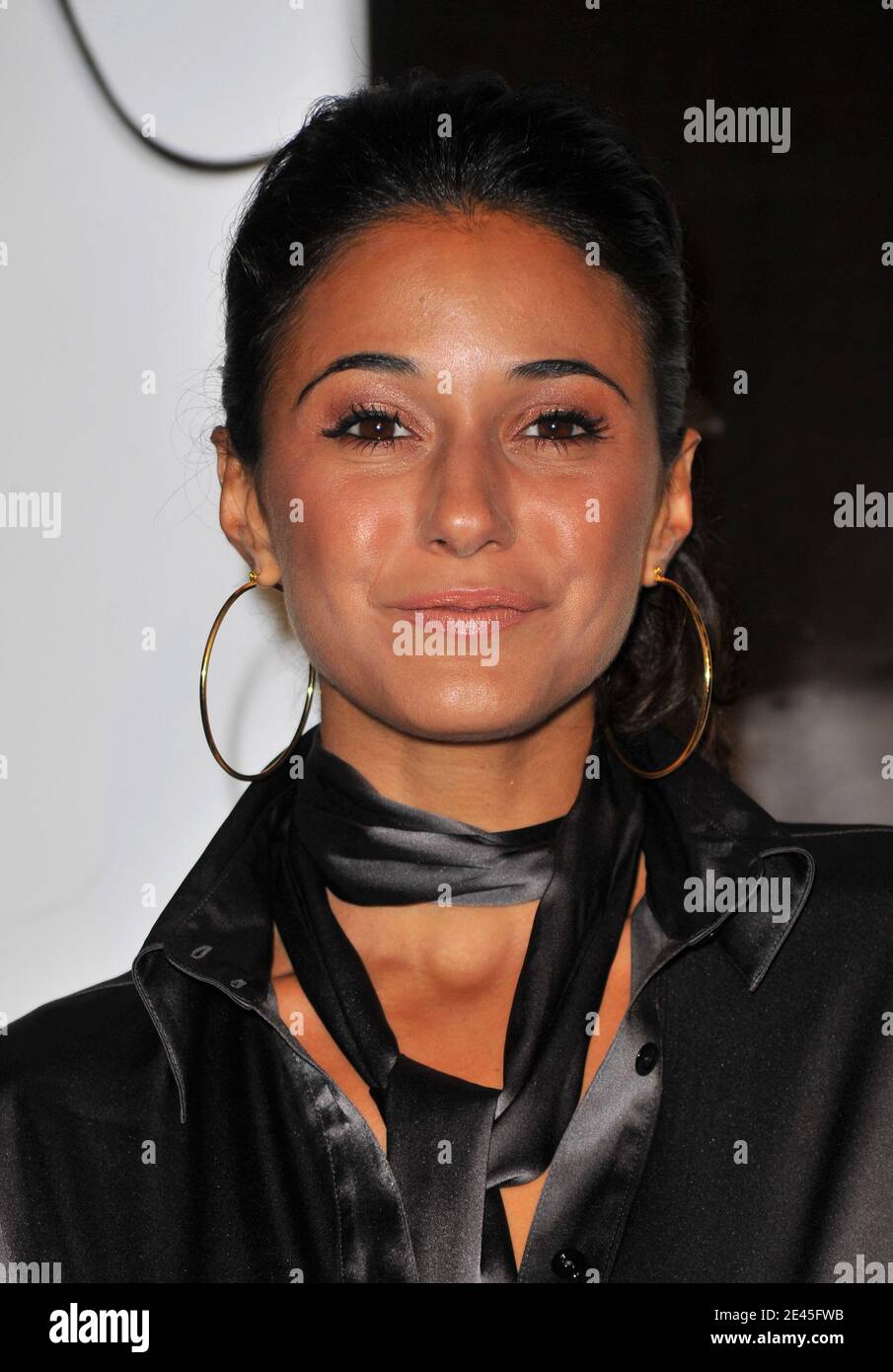 Actress Emmanuelle Chriqui walks the red carpet during Burberry Day at