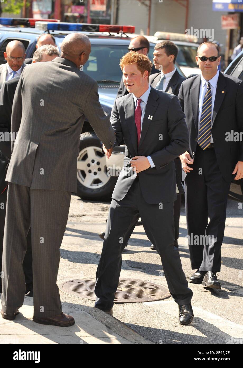 HRH Prince Harry arrives at the Harlem Children's zone school to meet children and view a range of facilities, at East Harlem, New York City, USA on May 30, 2009. He is greeted by Geoff Canada, CEO Harlem Children's Zone. Photo by S.Vlasic/ABACAPRESS.COM (Pictured: Prince Harry, Geoff Canada) Stock Photo
