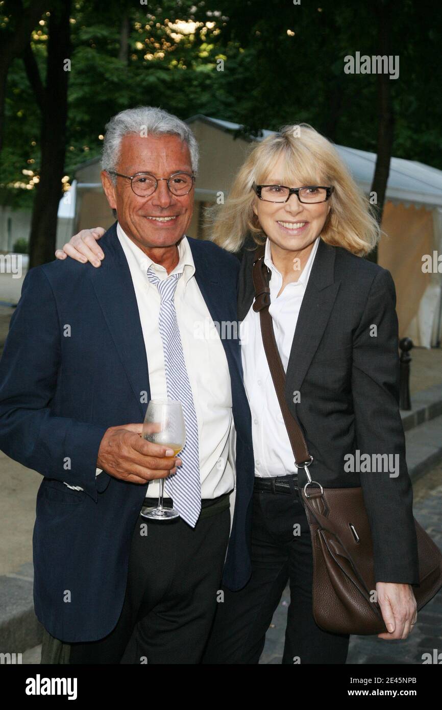 Jean-Marie Perier and Mireille Darc attend the opening of Photographer Jean-Marie  Perier's exhibition in Paris, France on June 4, 2009. Photo by Denis  Guignebourg/ABACAPRESS.COM Stock Photo - Alamy