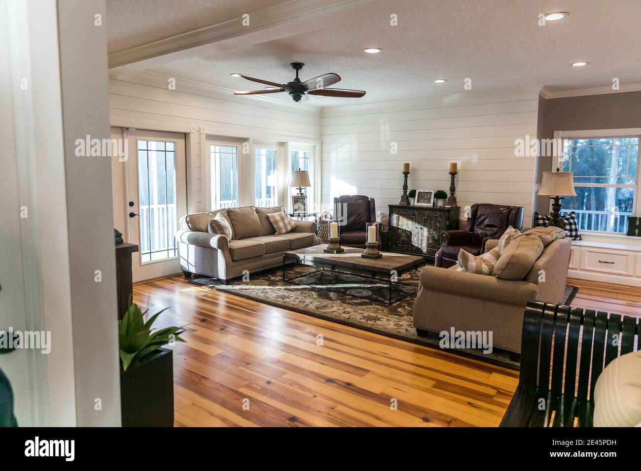 A new addition of an updated living room and den with pine hardwood floors Stock Photo