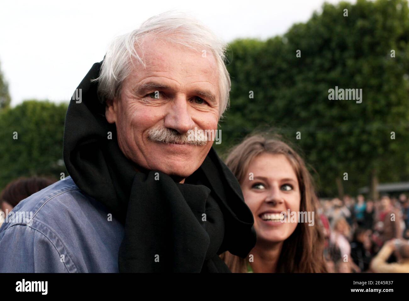 French photographer and director Yann Arthus-Bertrand is seen prior to the  presentation of the movie 'Home' on a giant screen displayed on Champ de  Mars garden, underneath the Eiffel Tower in Paris,