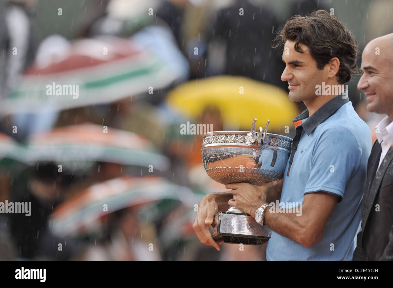 Switzerland's Roger Federer holds the trophy following his victory during the Men's Singles Final match against Sweden's Robin Soderling at the French Open at Roland Garros in Paris, France on June 7, 2009. The victory gives Federer 14 Grand Slams, tying his career wins to American Pete Sampras. Federer won 6-1, 7-6 (7/1), 6-4. Photo by Christophe Guibbaud/Cameleon/ABACAPRESS.COM Stock Photo