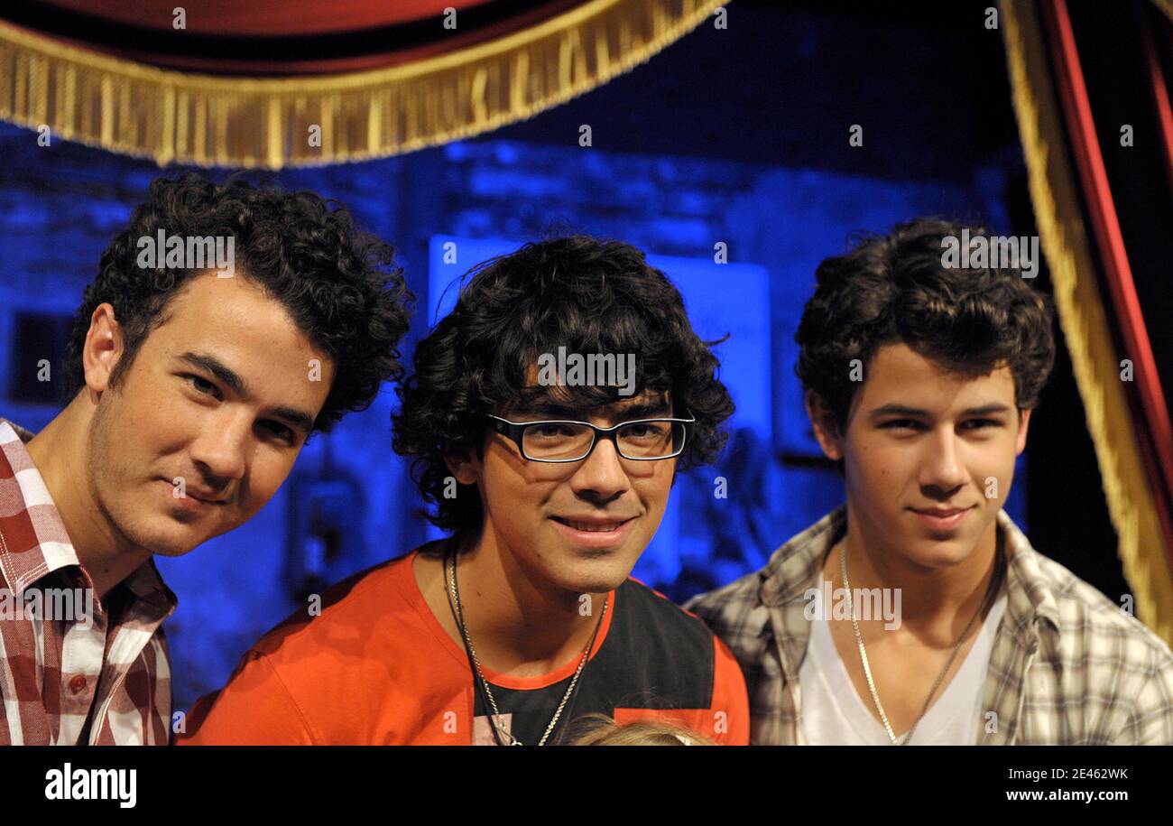 Kevin, Joe, and Nick from Jonas Brothers pose for a Photocall to