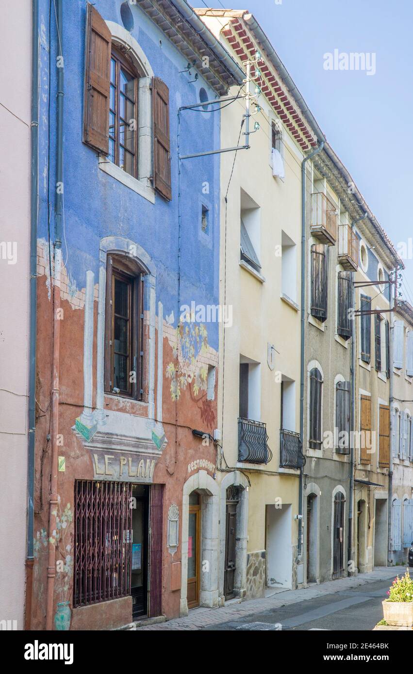 faded facades at Rue du Plan, Saint-Hippolyte-du-Fort, Gard department, Occitanie region, Southern France Stock Photo