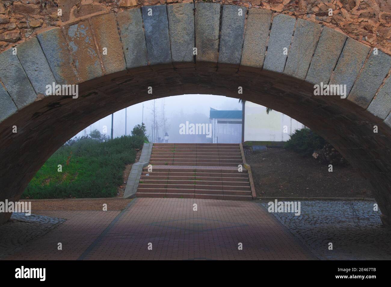 Old medieval reddish bridge arch on background of urban stairs Stock ...