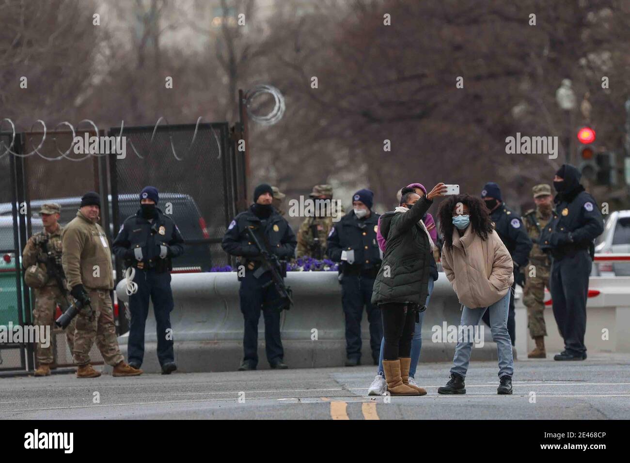 Civilians take selfies in front of a restricted area during Inauguration day Wednesday, Jan. 20, 2021, in Washington D.C Credit: Saquan Stimpson/CNP | usage worldwide Stock Photo