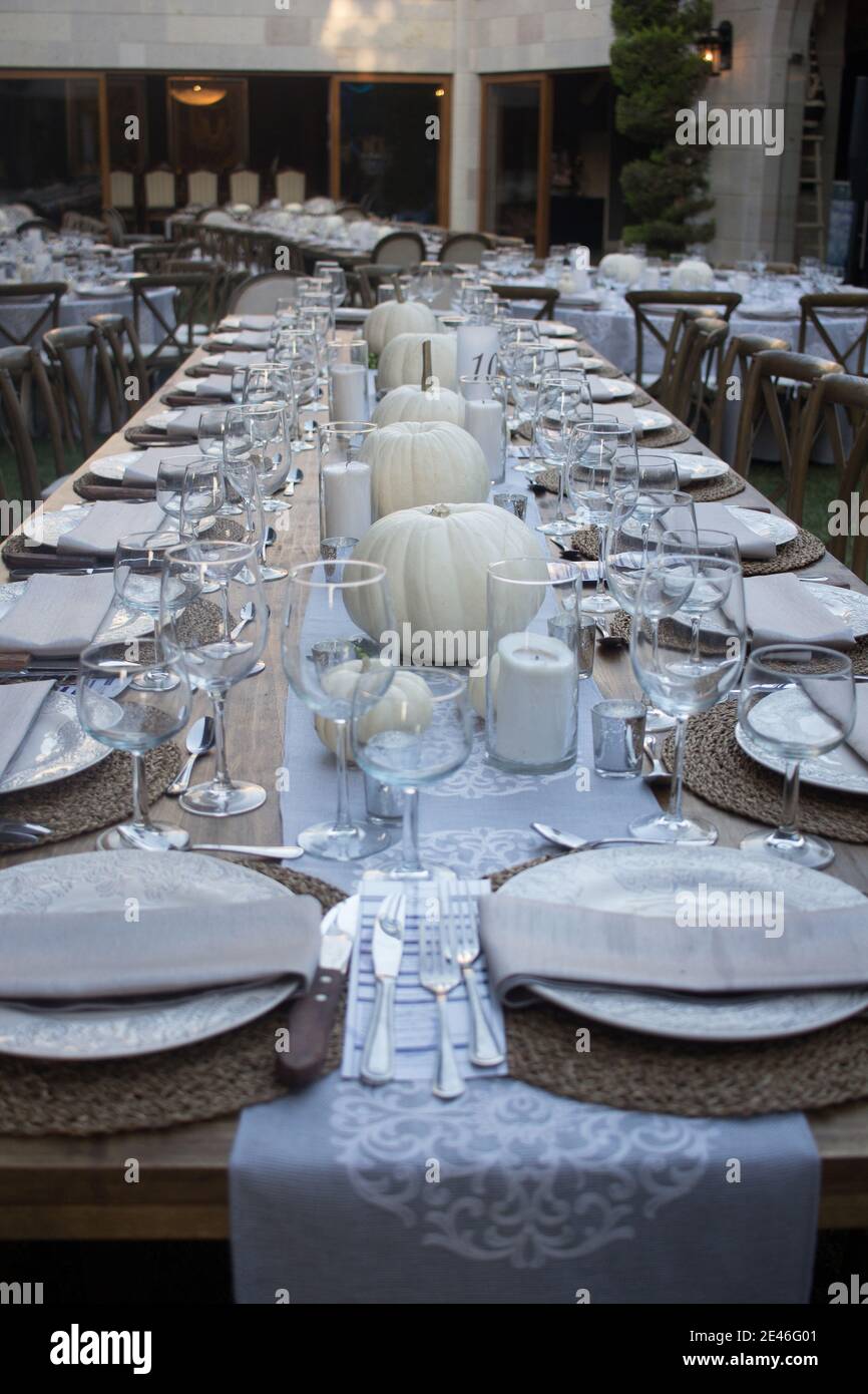 Elegant dinner table served on a garden Stock Photo