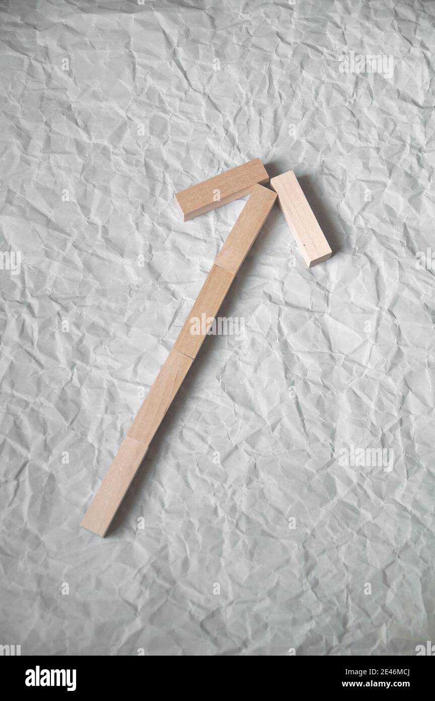 background of crumpled craft paper with wooden rectangles arranged in a certain order in a minimalist style Stock Photo