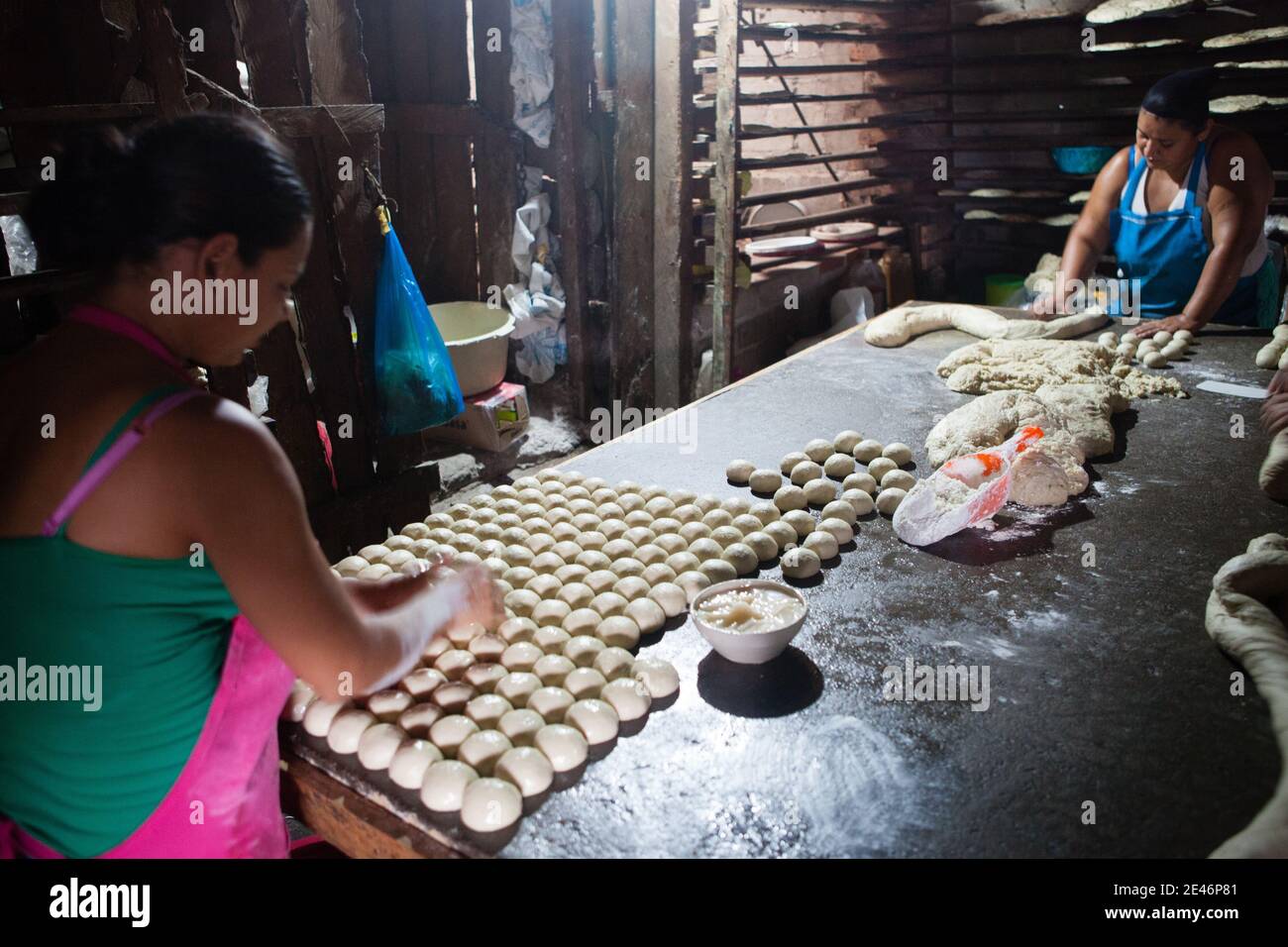 Mexican Bread Makers Setting Dough Balls on Traditional Table Stock Photo