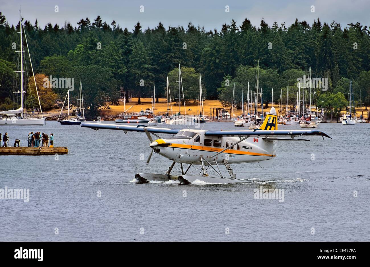 A commuter float plane taxing to the dock at the harbour in Nanaimo on Vancouver Island British Columbia Canada. Stock Photo