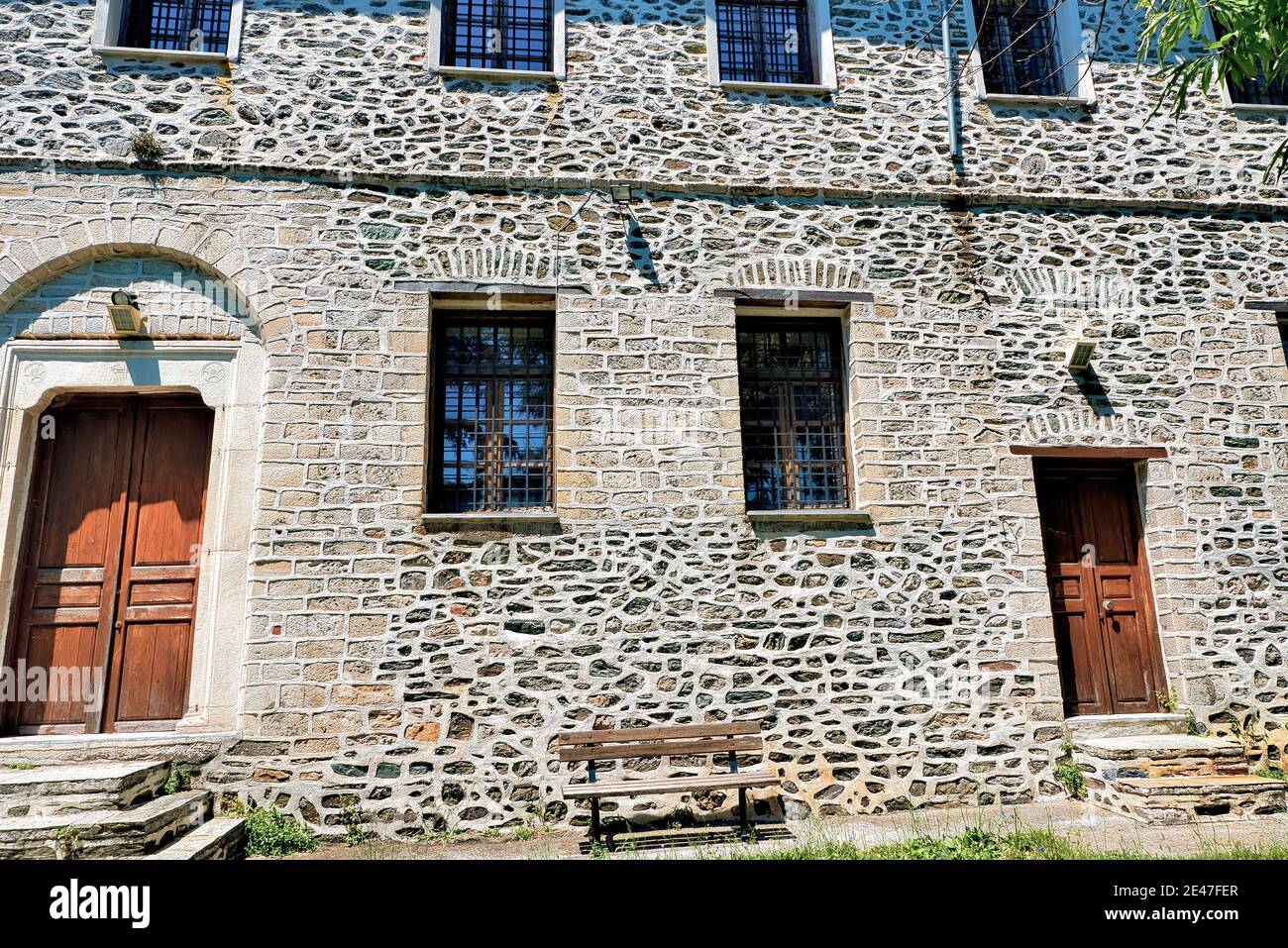 Old typical stone building under the sunlight in Greece Stock Photo