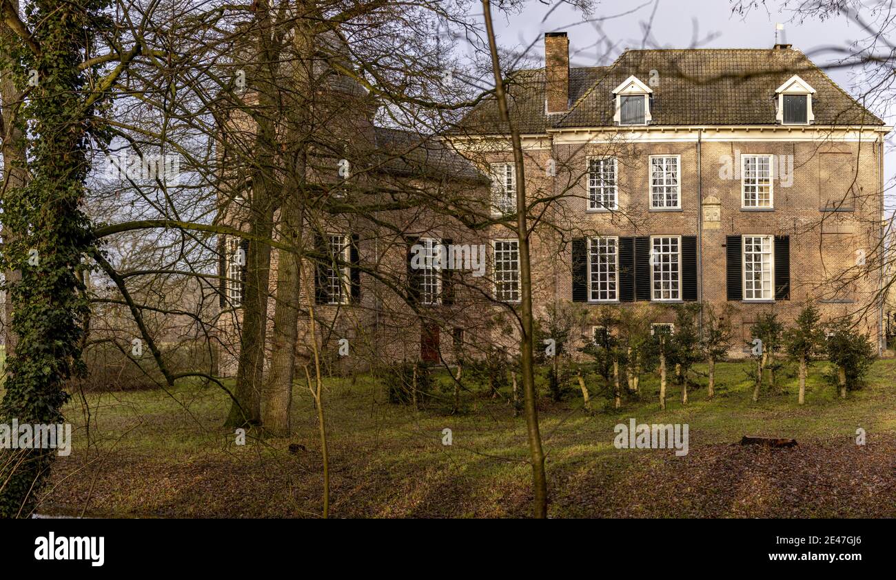 VORDEN, NETHERLANDS - Jan 08, 2021: Sideview of Hackfort castle in midday sunligh Stock Photo