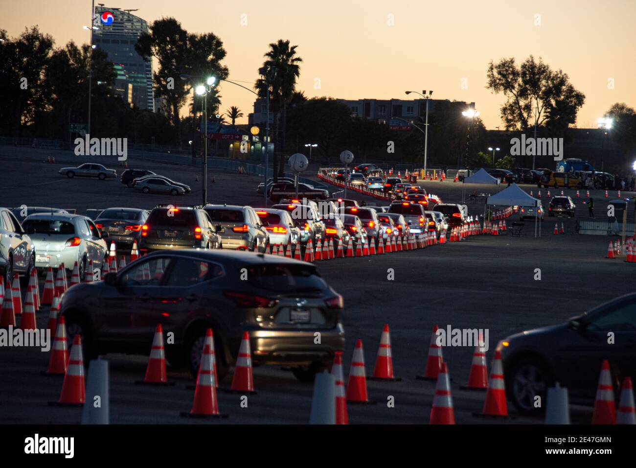 Covid tents and cars lined up with people waiting to get their COVID-19 vaccinations; Dodger Stadium, Los Angeles, CA USA. Stock Photo
