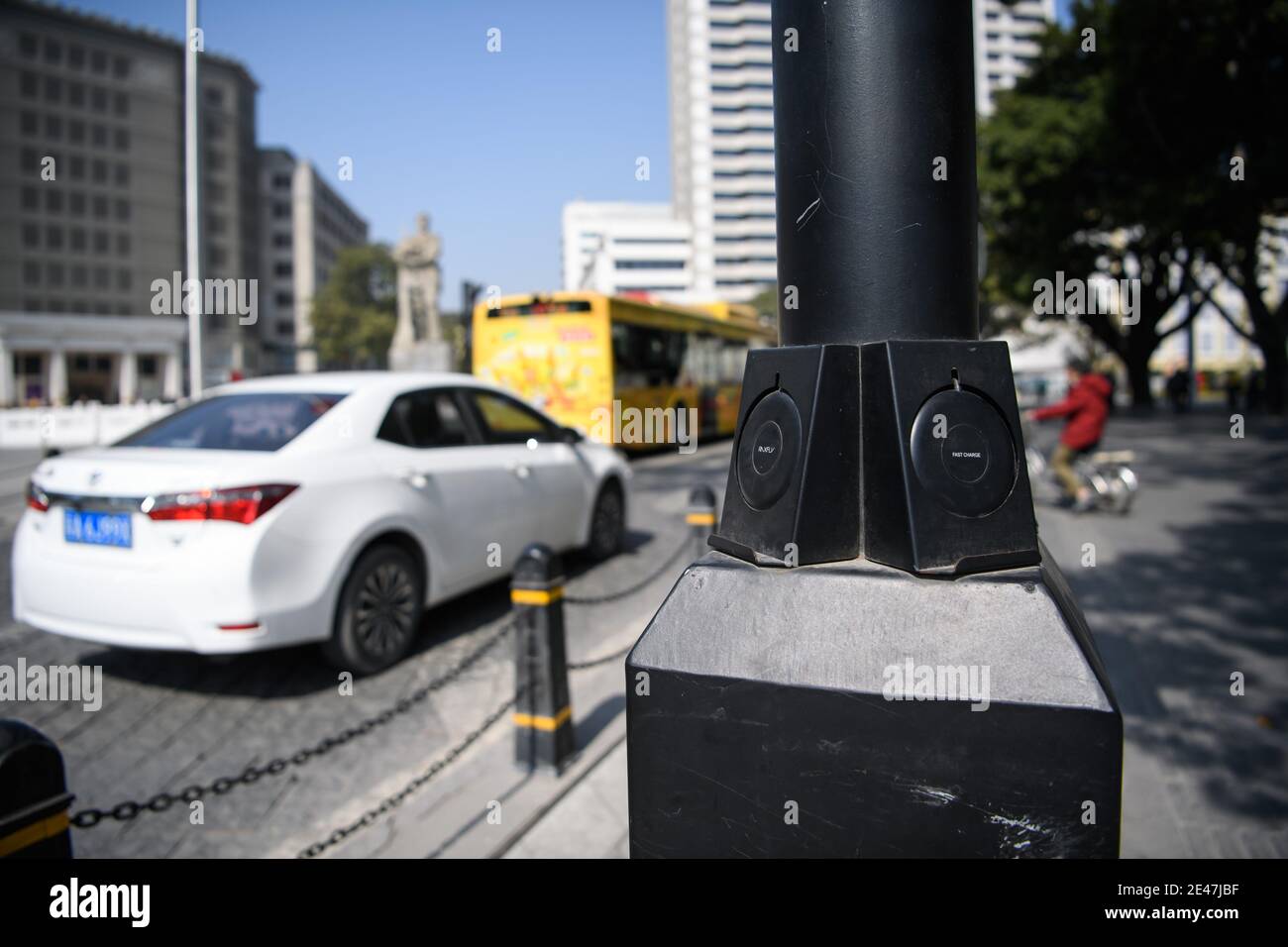 A gadget provides wireless charging for smartphone of pedestrians are seen attached to a streetlamp in Guangzhou city, south China¯s Guangdong provinc Stock Photo