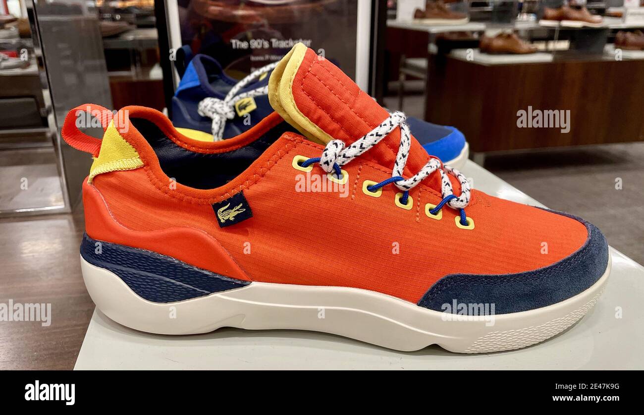 FRESNO, UNITED STATES - Jan 04, 2021: A Photo of the New 2021 Mens Subra  Impact Lacoste 220 bright Orange with Yellow Trim Athletic Shoes in store  Stock Photo - Alamy