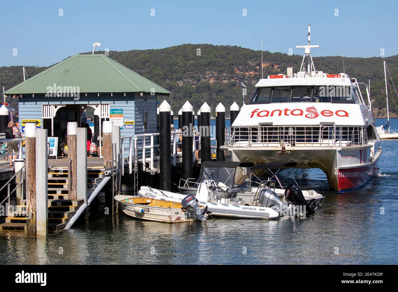 Palm Beach ferry wharf on Pittwater and Fantasea ferry cruiser awaiting passengers,Sydney