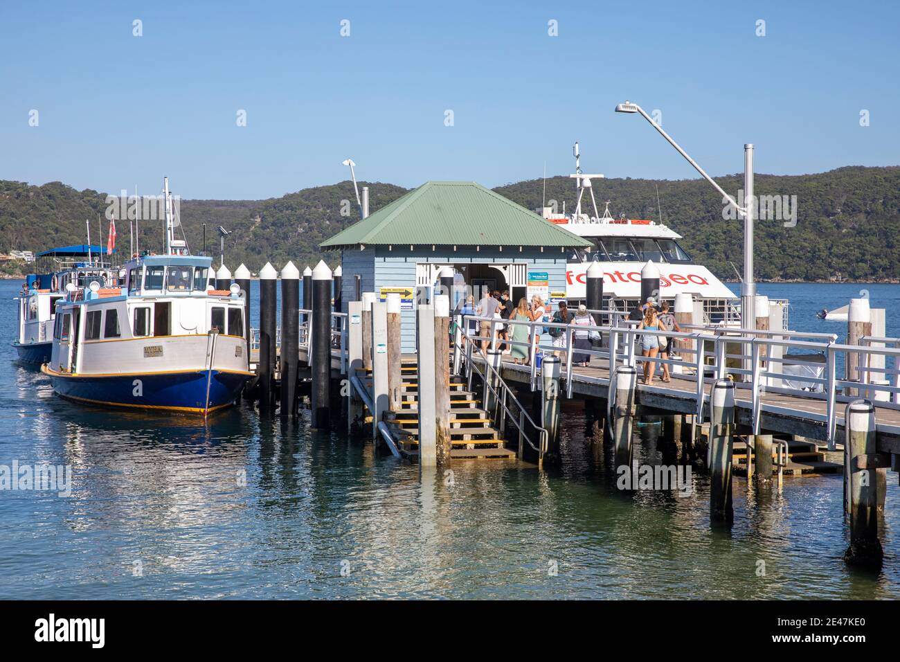 Palm Beach ferry wharf on Pittwater and Fantasea ferry cruiser awaiting passengers,Sydney,Australia Stock Photo
