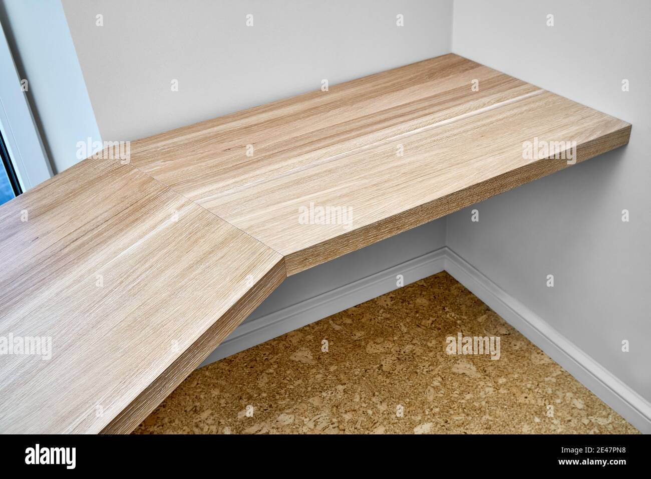 Elegant writing desk made with bleached solid oak timber mounted on white wall, upper view Stock Photo
