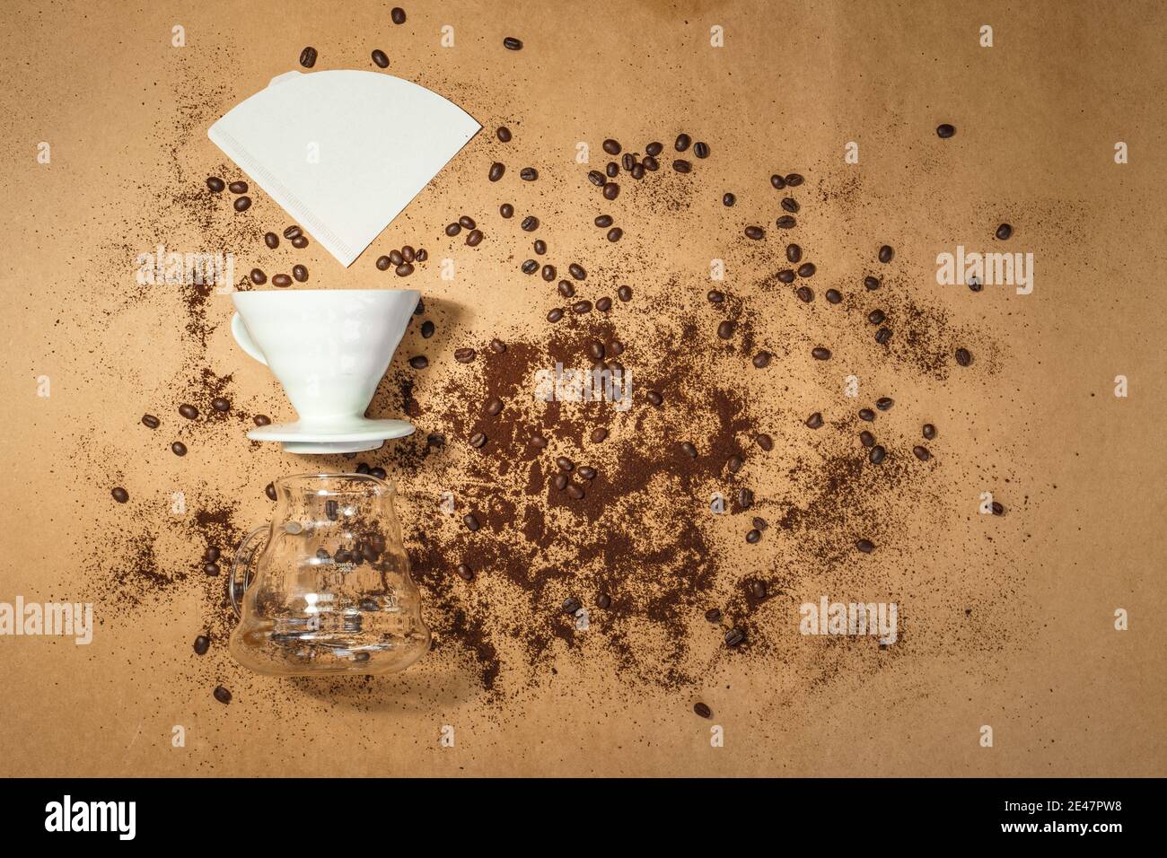 Coffee dripper,Drip paper and coffee drip jar On a brown background