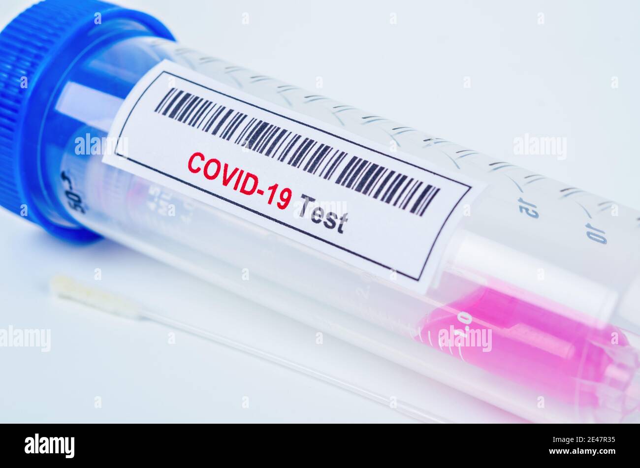 Tube containing nasopharyngeal swab for coronavirus or COVID-19 test in laboratory. Stock Photo