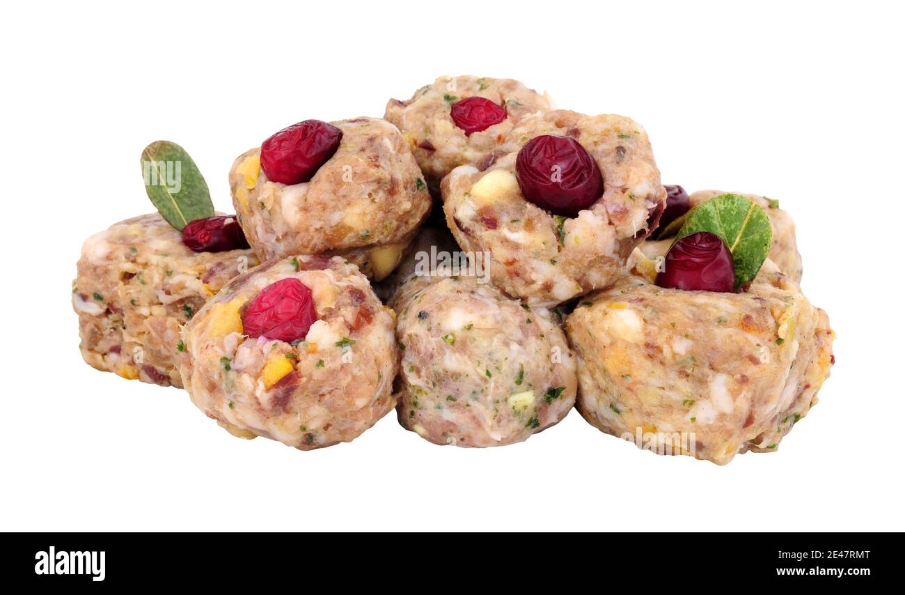 Group of raw pork meat stuffing balls with cranberries isolated on a