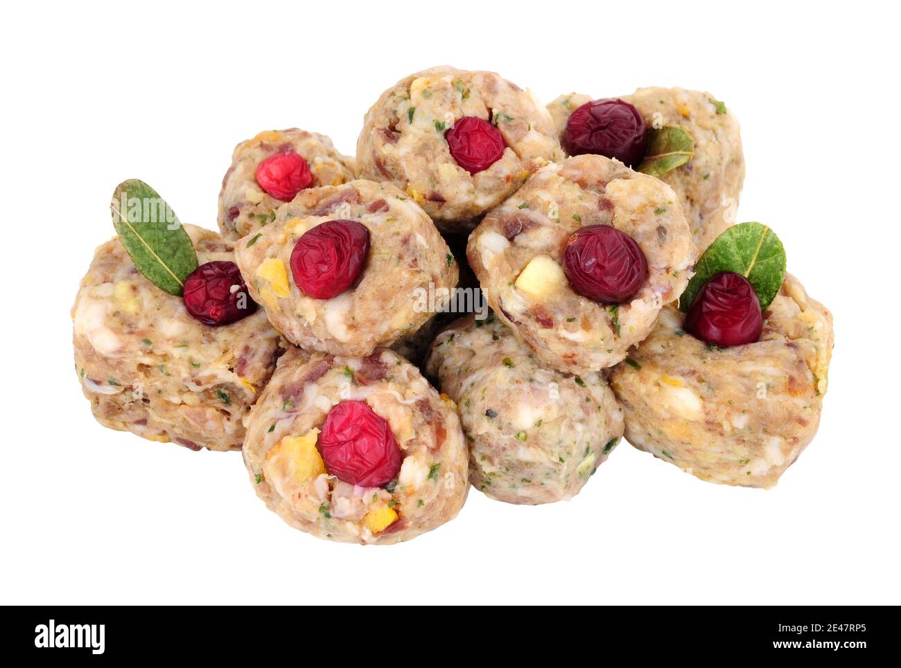 Group of raw pork meat stuffing balls with cranberries isolated on a