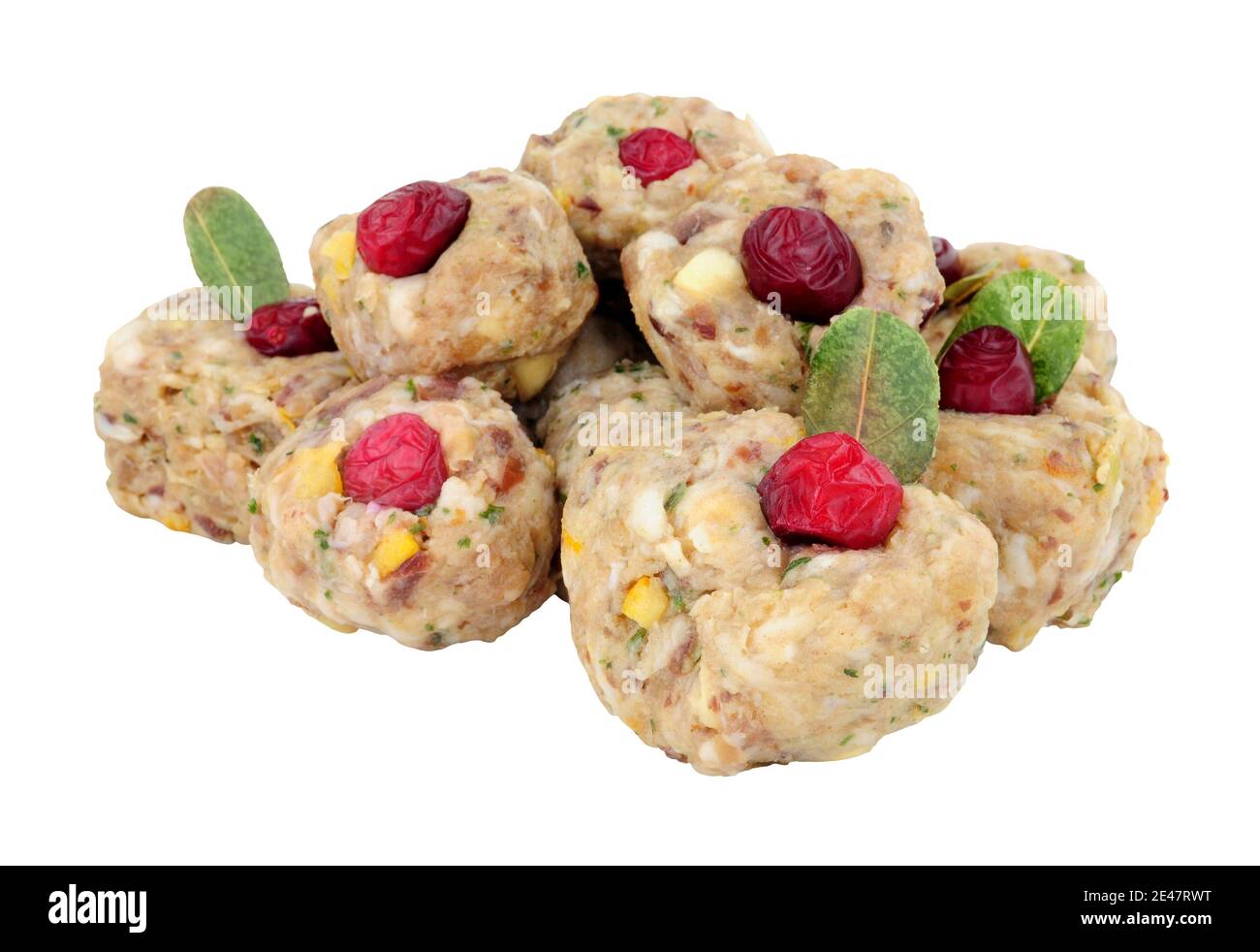 Group of raw pork meat stuffing balls with cranberries isolated on a white background Stock