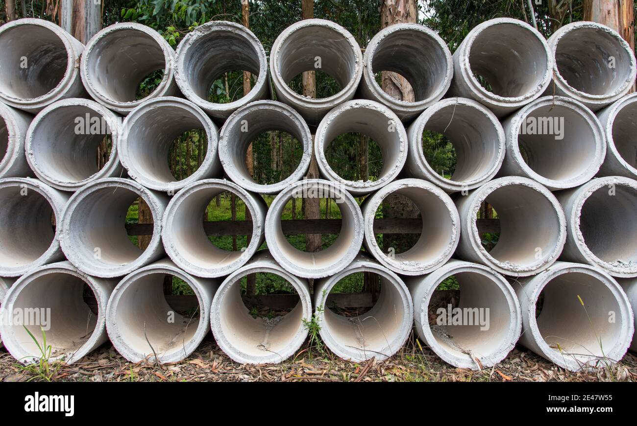 Pile of concrete pipes in a park Stock Photo Alamy