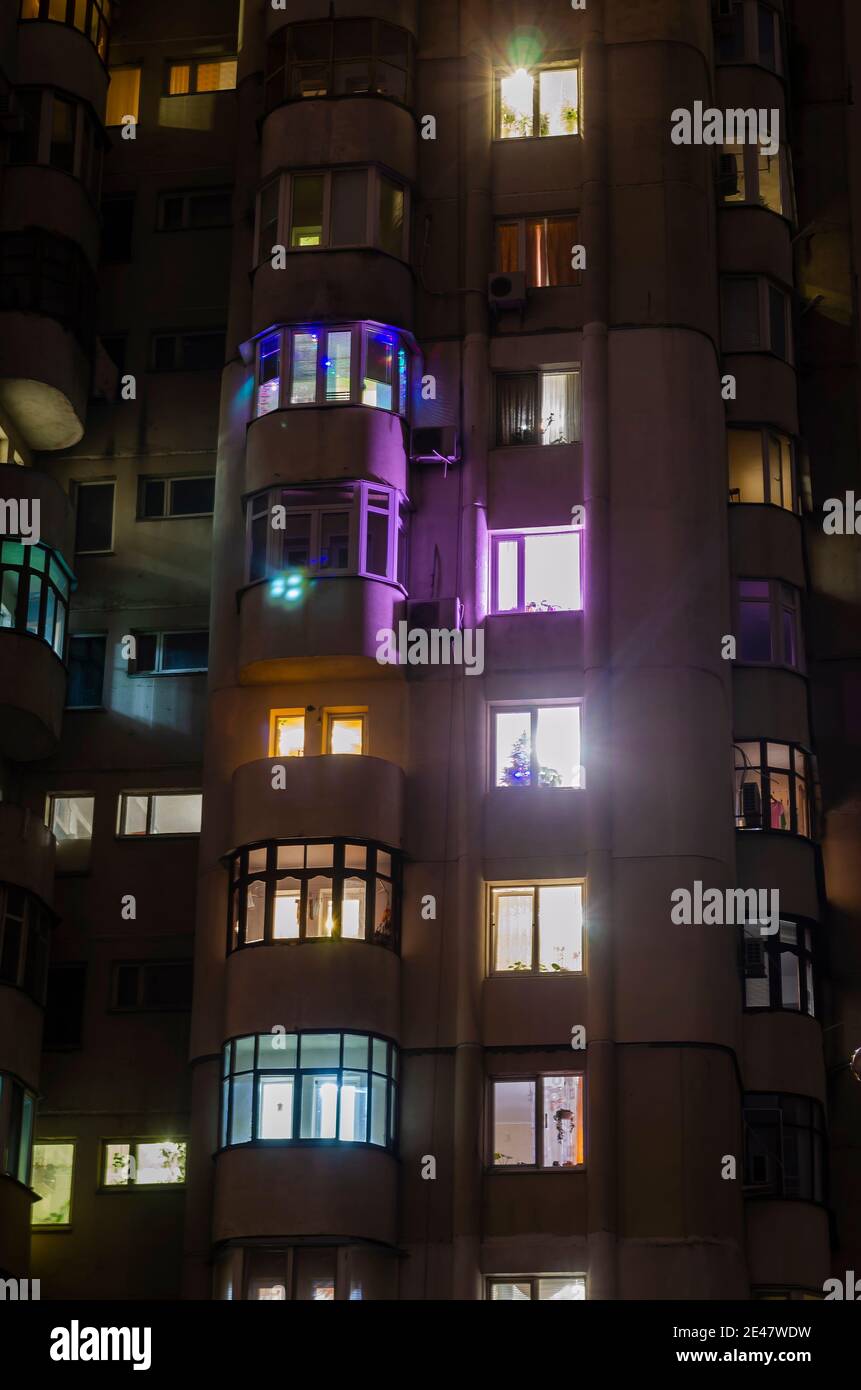 Defocused Shot City Apartments At Night Front View Of High Rise Building With Windows Of Apartments In Which Light Is Burning Stock Photo Alamy