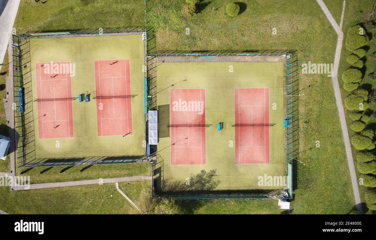 Park with tennis courts above drone top view on bright sunny day Stock Photo