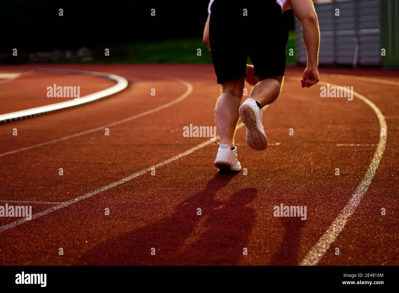 athlete is sprinting over the running track Stock Photo