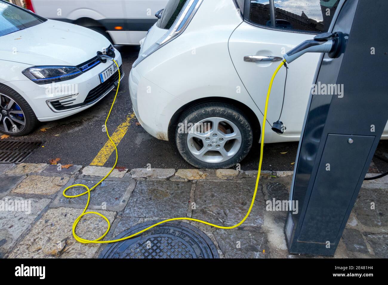 VW car charging electric car charger, supply plugged Palma de Mallorca Spain charging station Stock Photo