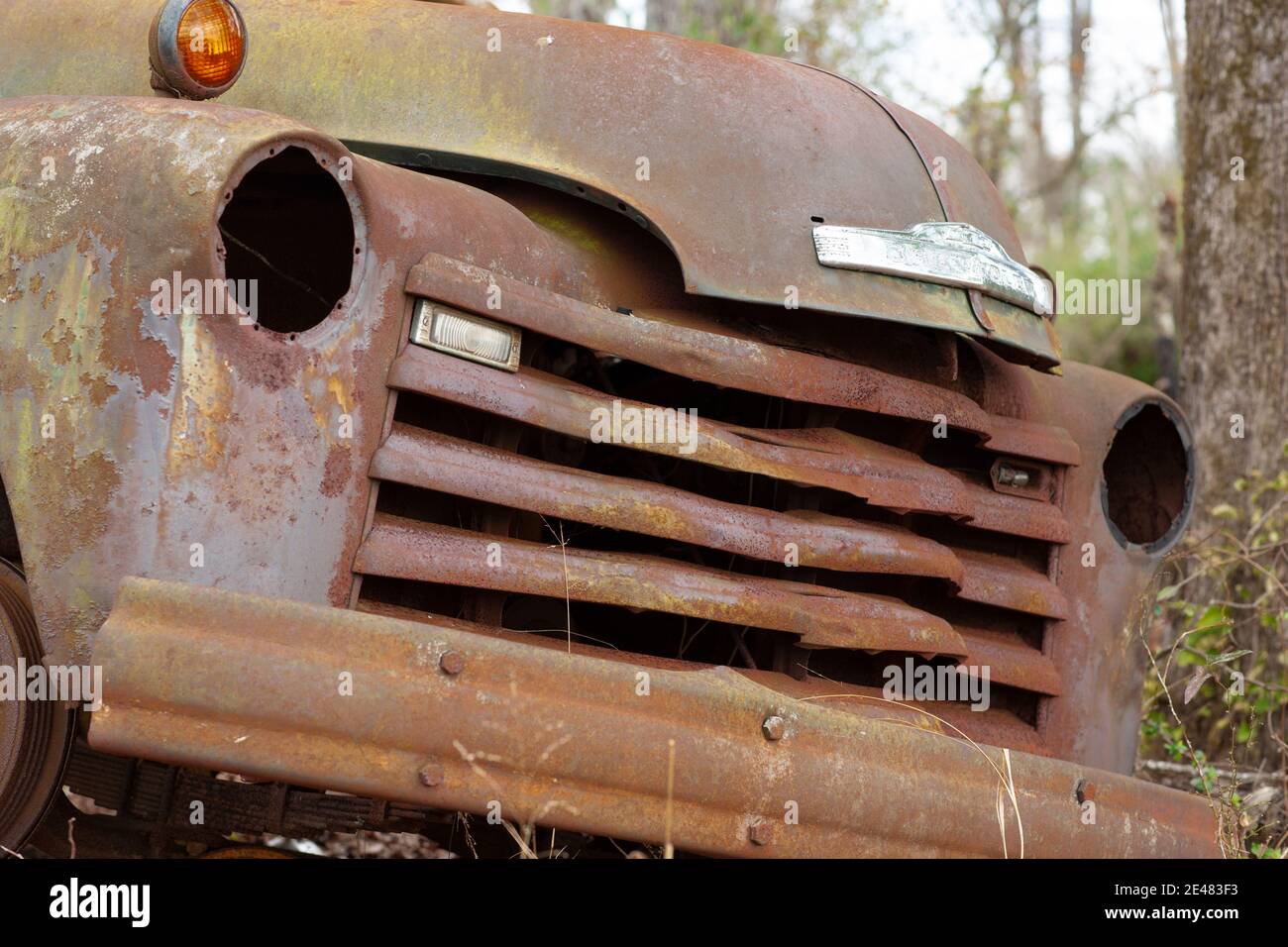 The grill of an old, rusty 1949 Chevrolet half ton pick-up work truck, in the woods, at Chrysler, Alabama  Chevrolet Advance-Design cab trucks were ma Stock Photo