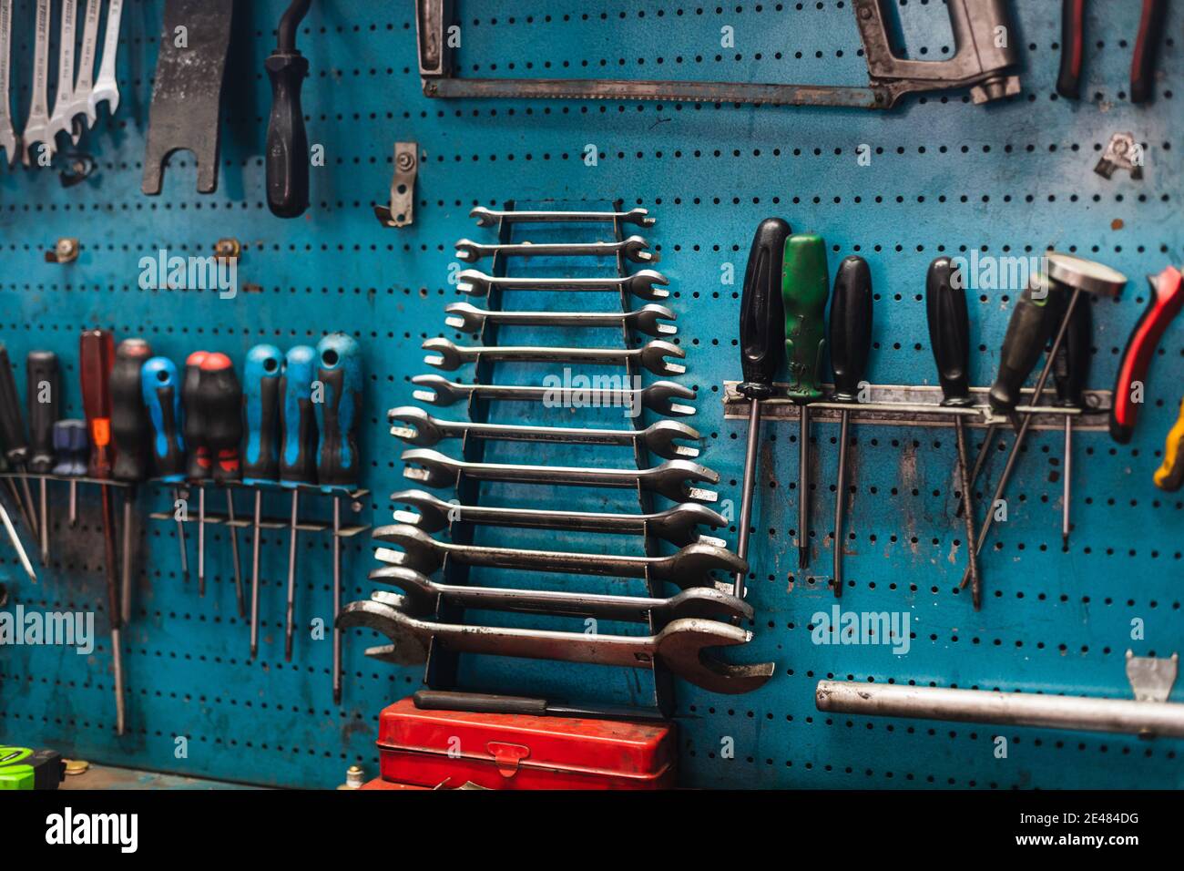 Сar driver using variety repair tools for repairing and diagnostic a car.  Tool set near the orange auto. Mechanic tools in box, closeup Stock Photo -  Alamy