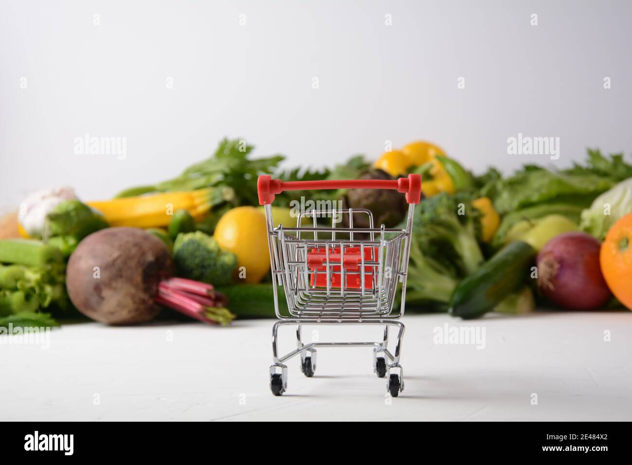 Shopping trolley cart and different fresh fruits and vegetables for ...