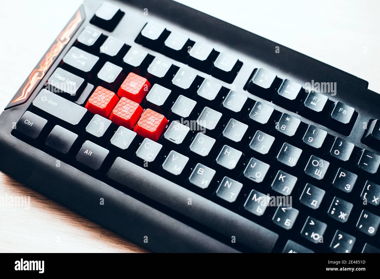 Black gaming keyboard with red AWSD keys - cyber sport work tool Stock Photo