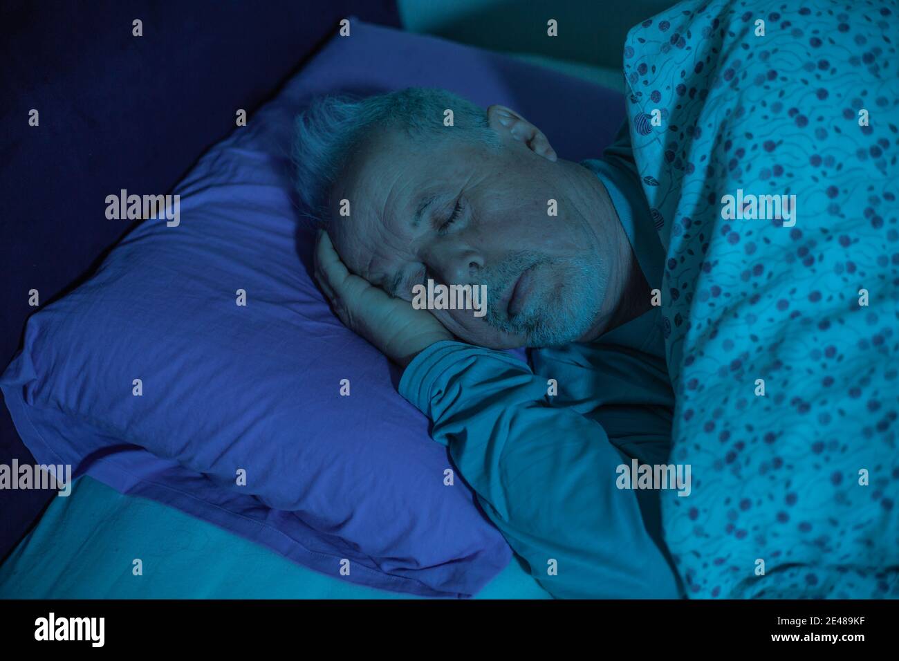 Senior man sleeping in deep sleep in the bed, healthcare concept Stock Photo