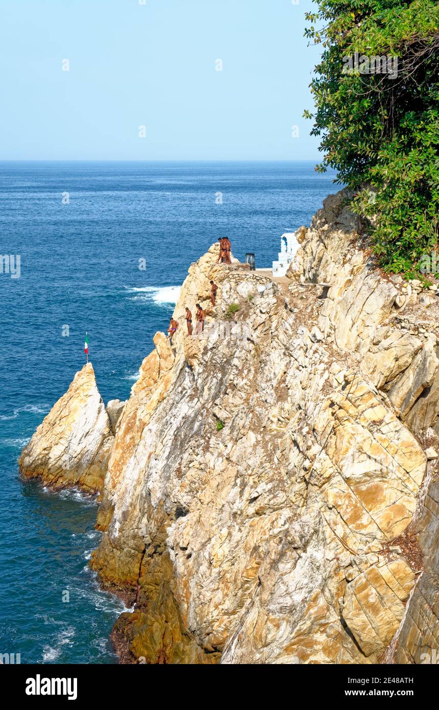 Cliff diver, a clavadista, diving off the cliffs at La Quebrada, Acapulco, Guerrero State, Mexico - 11th of January 2011 Stock Photo