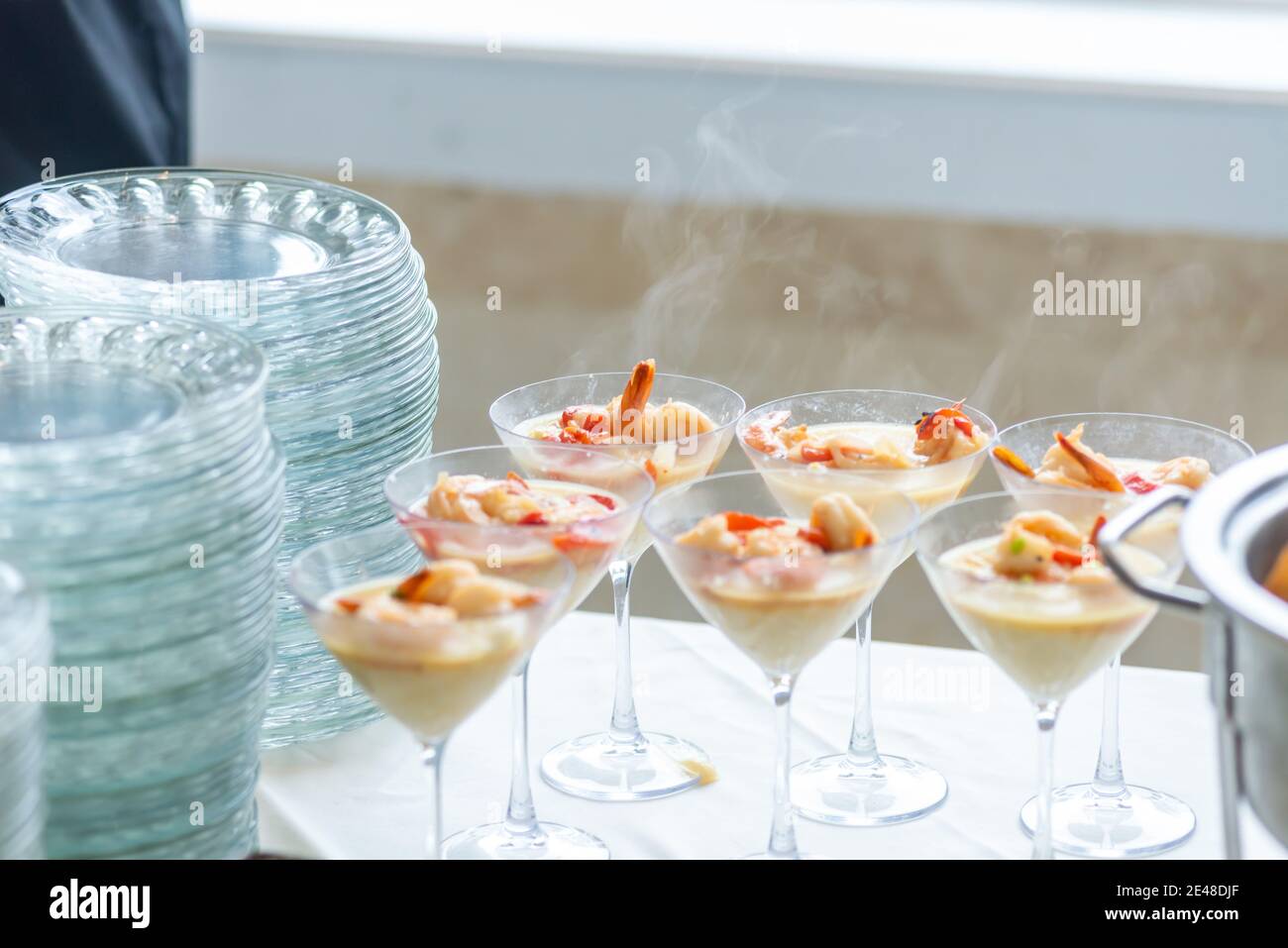 Shrimp & grits side dish appetizer in fancy martini cocktail glasses
