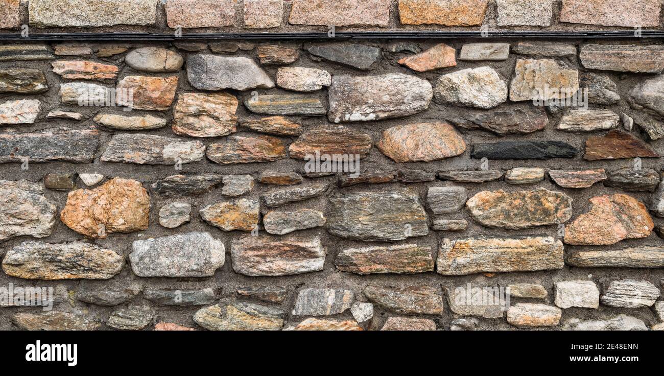Detail of stone wall constructed from various rocks including granite and Precambrian gneiss, Belmullet, County Mayo, Ireland Stock Photo
