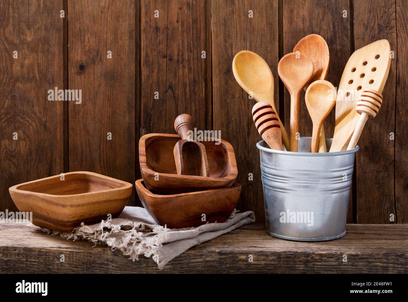various kitchen utensils on wooden shelf Stock Photo