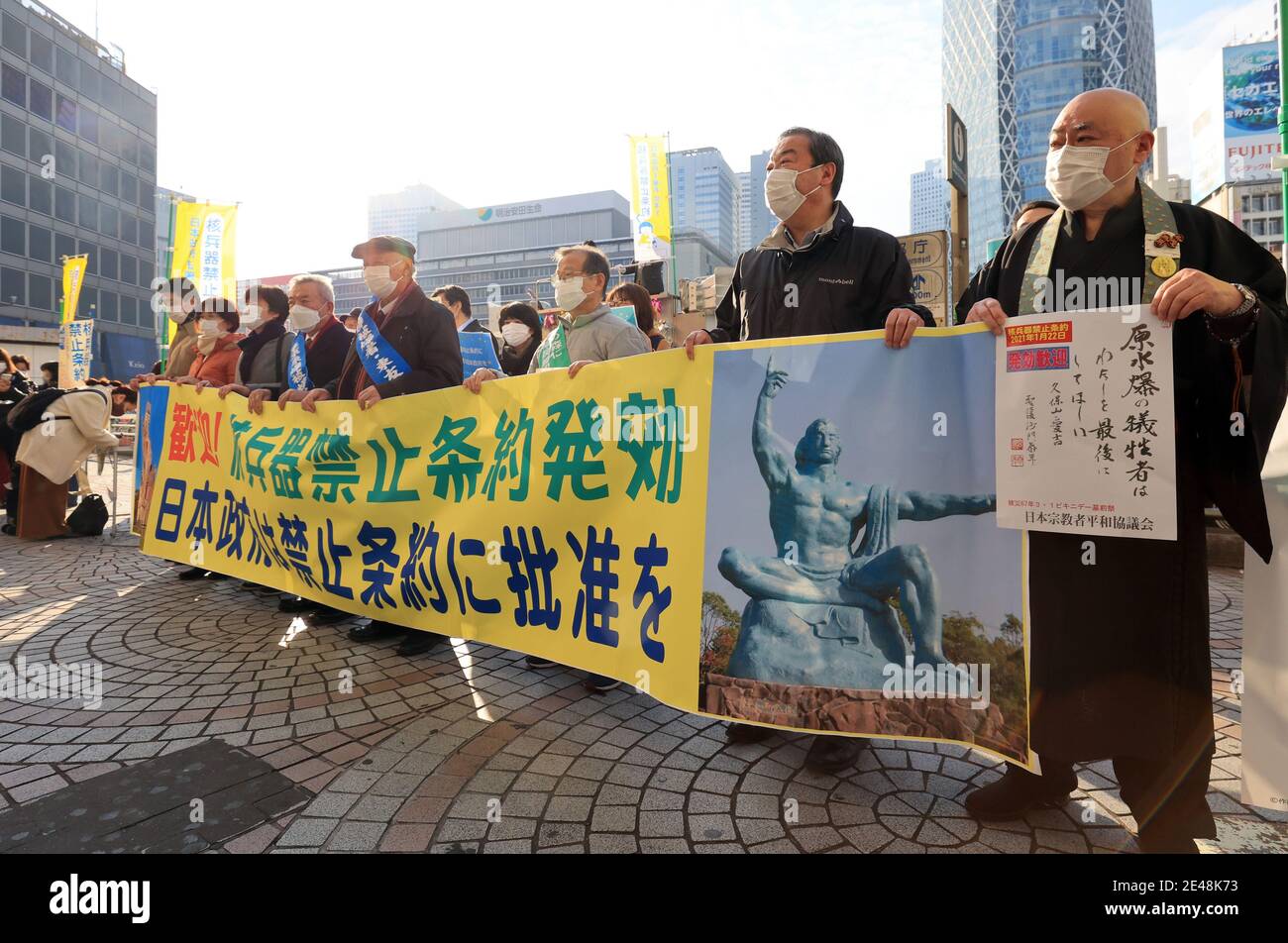 Tokyo, Japan. 22nd Jan, 2021. Antinuclear civic group members including A-bomb survivors (hibakusha) hold banners and placards to collect signatures for the petition to request Japanese government to ratify U.N. Treaty on the Prohibition of Nuclear Weapons in Tokyo on Friday, January 22, 2021. The treaty banning nuclear weapons set to enter into force on January 22 but Japanese government has not sign the treaty. Credit: Yoshio Tsunoda/AFLO/Alamy Live News Stock Photo