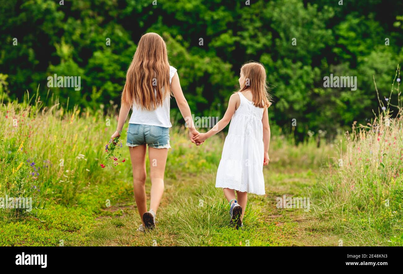 Teen girl walking dog hi-res stock photography and images - Alamy