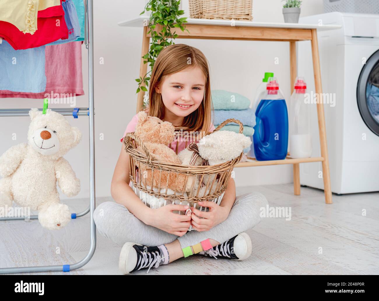 Child girl washing machine hires stock photography and images Alamy