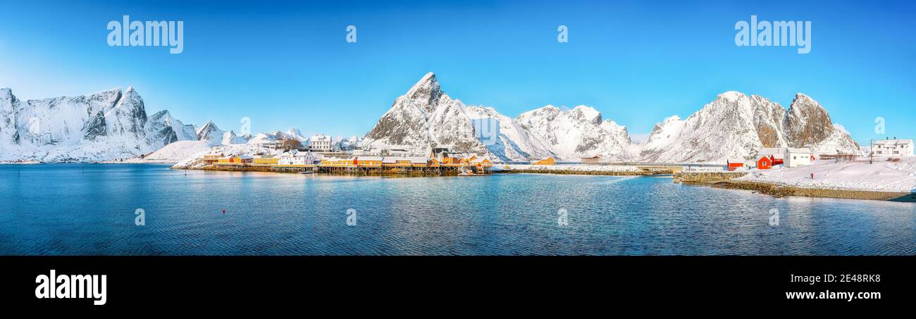 Beathtaking winter view of Sakrisoy village and snowy mountaines on background. Popular tourist destination on Lofotens.   Location: Sakrisoy , Mosken Stock Photo