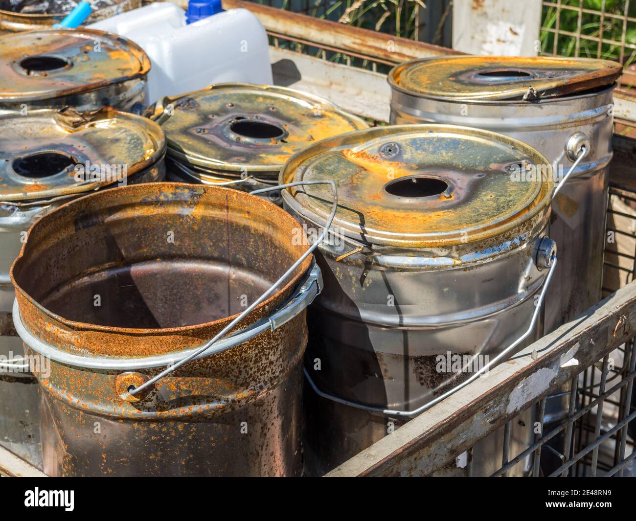 Empty tin paint bucket with rust Stock Photo