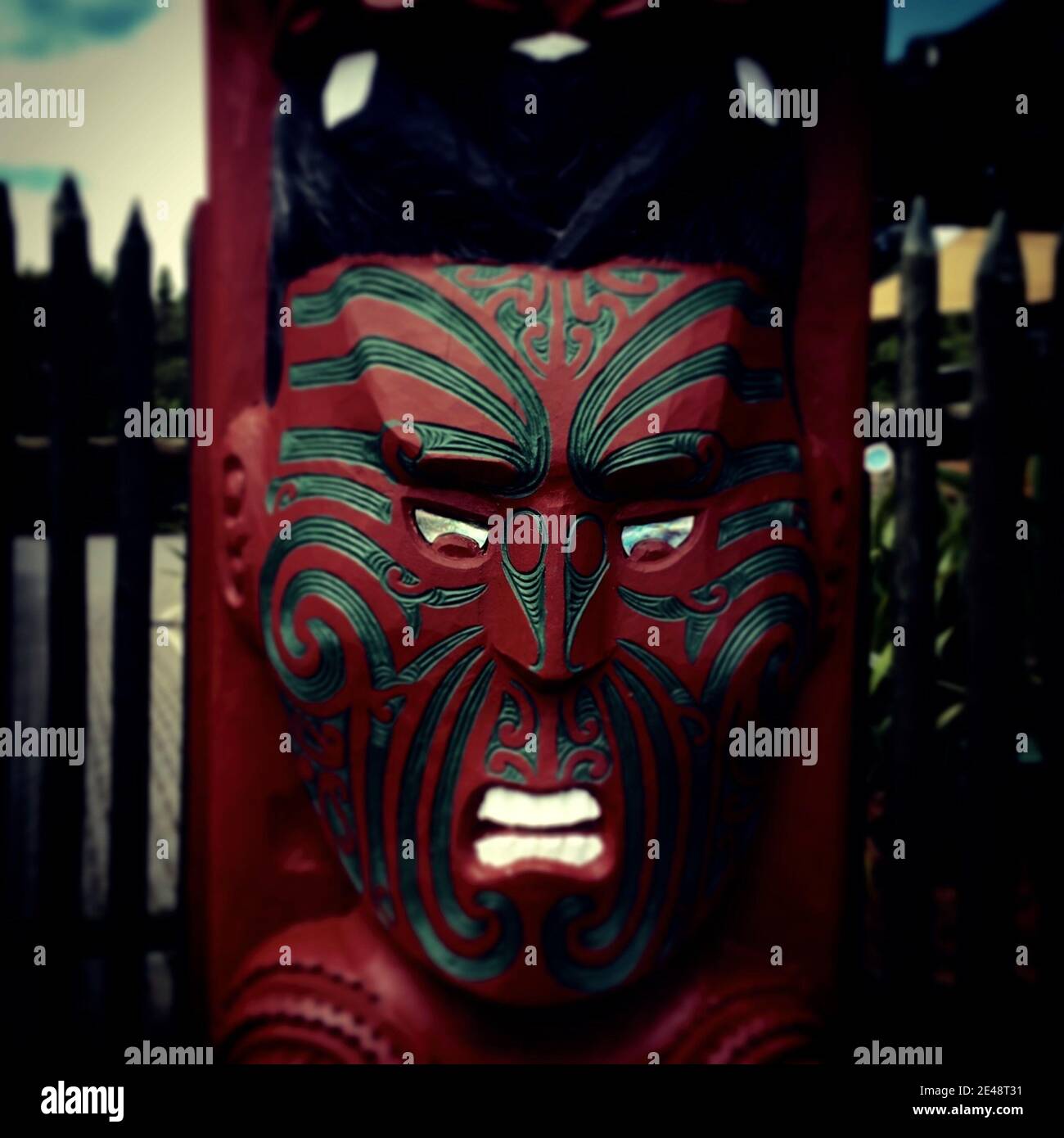 ROTORUA, NEW ZEALAND - Jan 04, 2016: Scary warrior wooden Maori mask handcrafted. Stock Photo