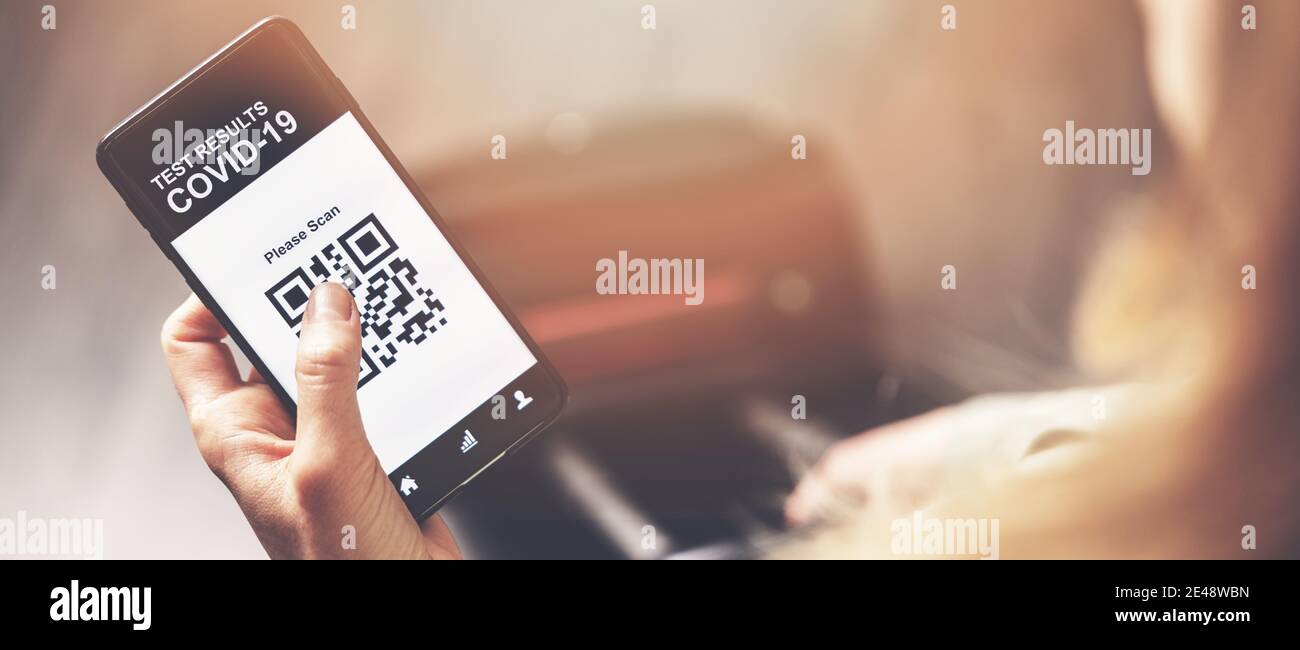 woman using mobile phone application with covid-19 test results in airport. safe travel new normal. copy space Stock Photo