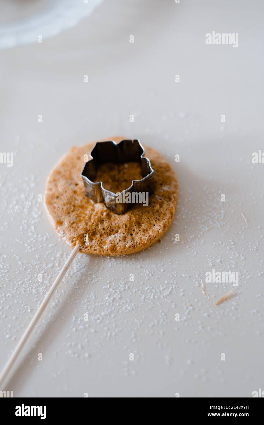 Dalgona Poki Lollipop, a traditional korean sponge candy Stock Photo