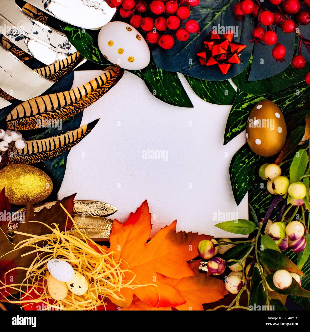 Happy Easter. Congratulatory easter background. Easter eggs and flowers. Flat lay. Nature concept. Stock Photo